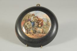 A PORCELAIN POT LID, LEND A BITE, 4ins diameter, framed.