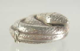 A SILVER SNAKE VESTA.