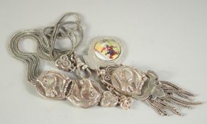 A SILVER HORSE WATCH CHAIN.
