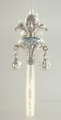 A SILVER AND MOTHER OF PEARL JESTER RATTLE.