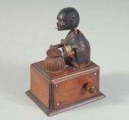 A JAPANESE CARVED WOOD ARTICULATED KOBE TOY, base 8cm x 6cm.