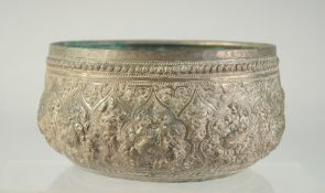 AN INDIAN EMBOSSED AND CHASED METAL BOWL, 16cm diameter.