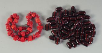 A CORAL BEADED NECKLACE, together with a ruby-colour necklace, (2).