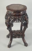A CHINESE MARBLE INSET CARVED HARDWOOD VASE STAND, with petal-shape top, carved and pierced