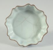 A CHINESE CELADON GLAZE PETAL-FORM BRUSH WASHER, 11.5cm at widest point.