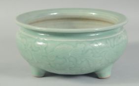 A 19TH CENTURY CHINESE CELADON GLAZE PORCELAIN BOWL / CENSER, with carved floral decoration to the