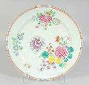 A CHINESE FAMILLE ROSE PORCELAIN CHARGER, finely enamel painted with native flora and gilt