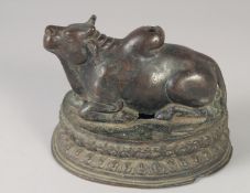 A RARE 16TH-17TH CENTURY INDIAN BRONZE BULL, 16cm long.