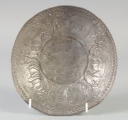 AN ISLAMIC SASSANID EMBOSSED SILVER BOWL, decorated with rams and fish, 19cm at widest point.