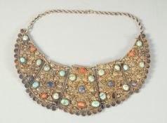 A FINE ISLAMIC OTTOMAN TURQUOISE AND CORAL INSET GILT METAL NECKLACE.