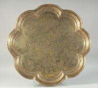 A LARGE PERSIAN ISFAHAN SIGNED ENGRAVED PETAL-FORM BRASS TRAY, inscribed and dated, engraved with