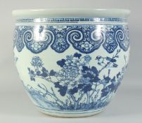 A LARGE 19TH CENTURY CHINESE BLUE AND WHITE PORCELAIN JARDINIERE, painted with birds and flora, (
