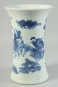 AN EARLY 20TH CENTURY BLUE AND WHITE PORCELAIN VASE, decorated with figures in a garden, 25.5cm