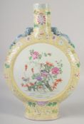 A LARGE CHINESE YELLOW GROUND FAMILLE ROSE PORCELAIN MOON FLASK VASE, painted with a panel on one