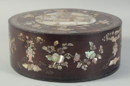 A CHINESE MOTHER OF PEARL INLAID CIRCULAR BOX AND COVER, with a central panel depicting a scene with