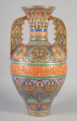 AN ISLAMIC GILT DECORATED PORCELAIN ALHAMBRA VASE, with various decorative motifs and a band of