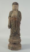 A CHINESE ARCHAIC WOOD SHAKYAMUNI BUDDHA, 56.5cm high.