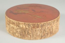 A 19TH CENTURY JAPANESE LACQUERED AND HAND GILDED CIRCULAR BOX, with cork/bark effect around the