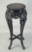 A CHINESE MARBLE INSET CARVED HARDWOOD VASE STAND, with carved and pierced foliate frieze on four