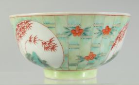 A CHINESE COPPER RED AND GREEN PORCELAIN BOWL, with bamboo and foliate decoration, character mark to