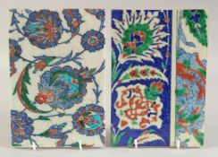TWO IZNIK GLAZED POTTERY TILES, with floral decoration, each 23.5cm x 16cm.