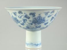 A CHINESE BLUE AND WHITE PORCELAIN STEM CUP, painted with foliate motifs, cup 15.5cm diameter.