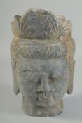A CARVED STONE BUDDHA HEAD, 25cm x 15cm.