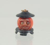 A VERY SMALL JAPANESE KOBE TOY PENDANT, with pop-out eyes, 15mm.