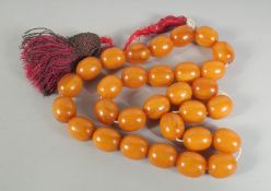 A MIXED-AMBER BEADED TASBIH.