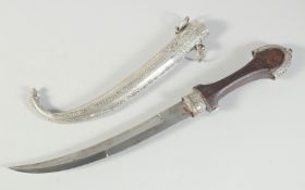 AN ISLAMIC MOROCCAN JAMBIYA DAGGER AND SCABBARD, 41cm long overall.