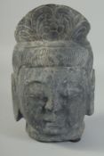 A CARVED STONE BUDDHA HEAD, 26cm x 17cm.