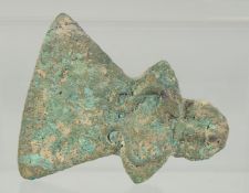 AN EARLY BRONZE AXE HEAD, with collar and triangular blade embellished with a heel in the shape of a