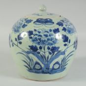 A 19TH CENTURY CHINESE BLUE AND WHITE JAR AND COVER, painted with flowers, butterfly and bats,