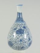 A FINE CHINESE KANGXI BLUE AND WHITE PORCELAIN BOTTLE VASE, painted with flower heads and