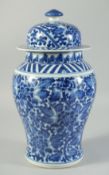 A 20TH CENTURY CHINESE BLUE AND WHITE PORCELAIN JAR AND COVER, 34cm high.