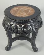 A CHINESE MARBLE INSET CARVED HARDWOOD STAND, 34cm high.