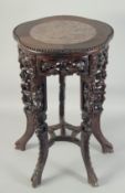 A CHINESE MARBLE INSET CARVED HARDWOOD VASE STAND, with petal-shape top, carved and pierced