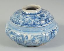 A 17TH CENTURY PERSIAN SAFAVID BLUE AND WHITE GLAZED POTTERY SQUATTED VASE, 15cm diameter.