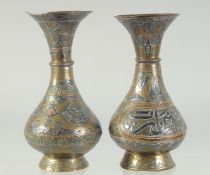 TWO SMALL 19TH CENTURY SYRIAN DAMASCUS MIXED METAL BRASS VASES, each approx. 14cm high.