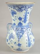 A TURKISH BLUE AND WHITE POTTERY MOSQUE LAMP, with three moulded handles and floral decoration, 35cm