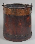 A GOOD 19TH CENTURY WOODEN COPPER MOUNTED PAIL with iron handle. 8ins high.