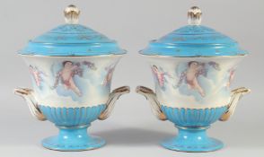 A PAIR OF CONTINENTAL LIGHT BLUE CUPID VASES AND COVERS. 11ins high.