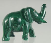A CARVED MALACHITE ELEPHANT. 2.5ins long.