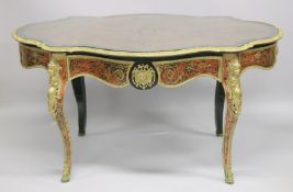 A SUPERB VICTORIAN BOULLE OVAL CENTRAL TABLE with brass inlay on tortoiseshell, fitted with a long