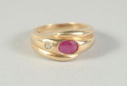 A 14CT GOLD RUBY AND DIAMOND SNAKE RING.