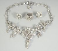 A VERY GOOD CHANEL DIAMANTE SET NECKLACE, RING AND EAR CLIPS in a Chanel box. OIA AIT125402008 COL/