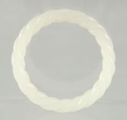 A WHITE JADE TWIST BANGLE.