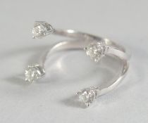 A GOOD 18CT WHITE GOLD RING set with four diamonds in original box.