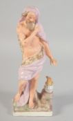 AN 18TH CENTURY STAFFORDSHIRE FIGURE OF WINTER, on a square base. 8.5ins high.
