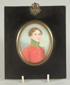19TH CENTURY IRISH SCHOOL. PORTRAIT MINIATURE OF A YOUNG MAN in a red uniform coat. 3ins x 2.25ins